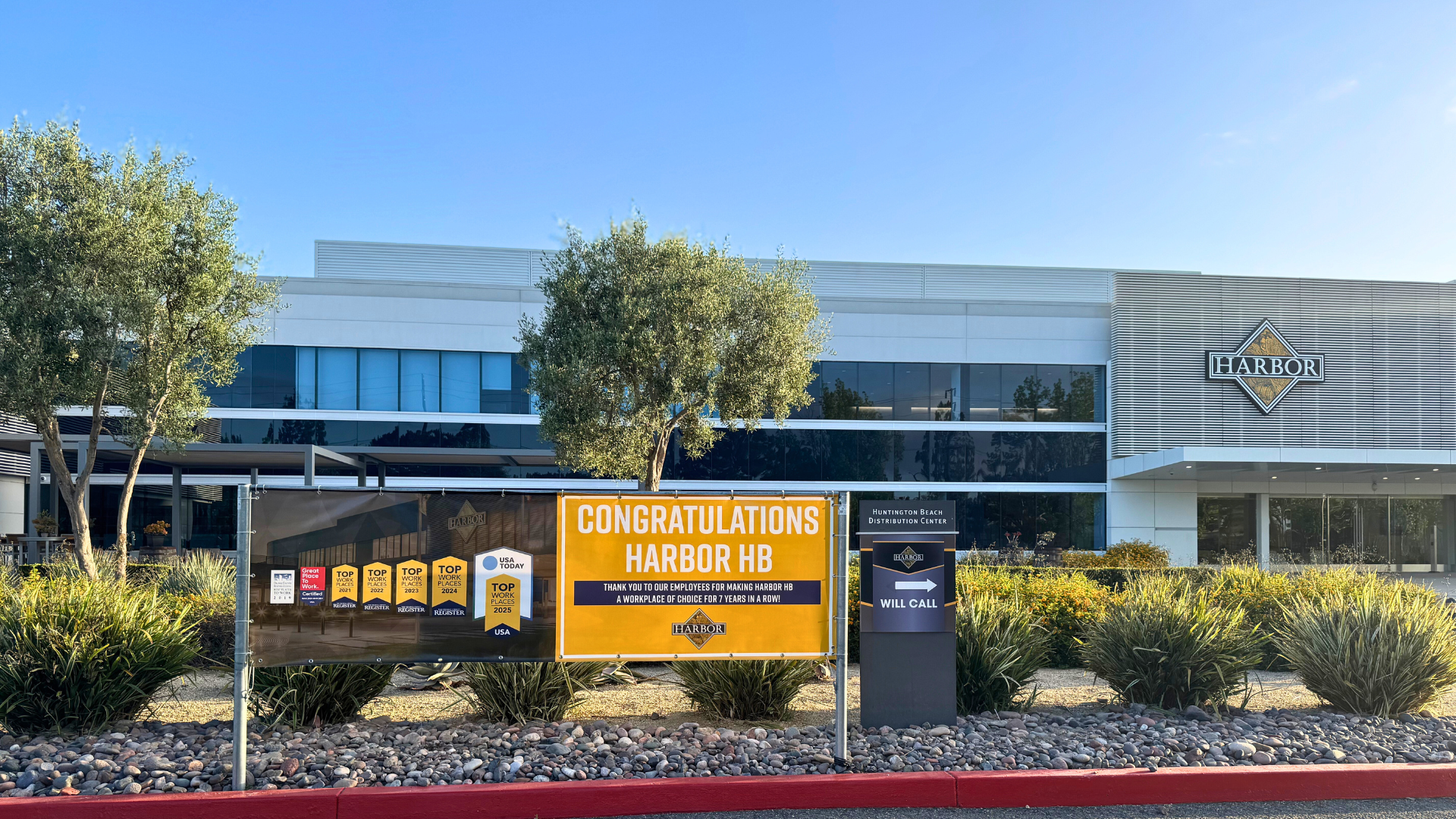 Workplace award sign in front of a building with a Harbor logo
