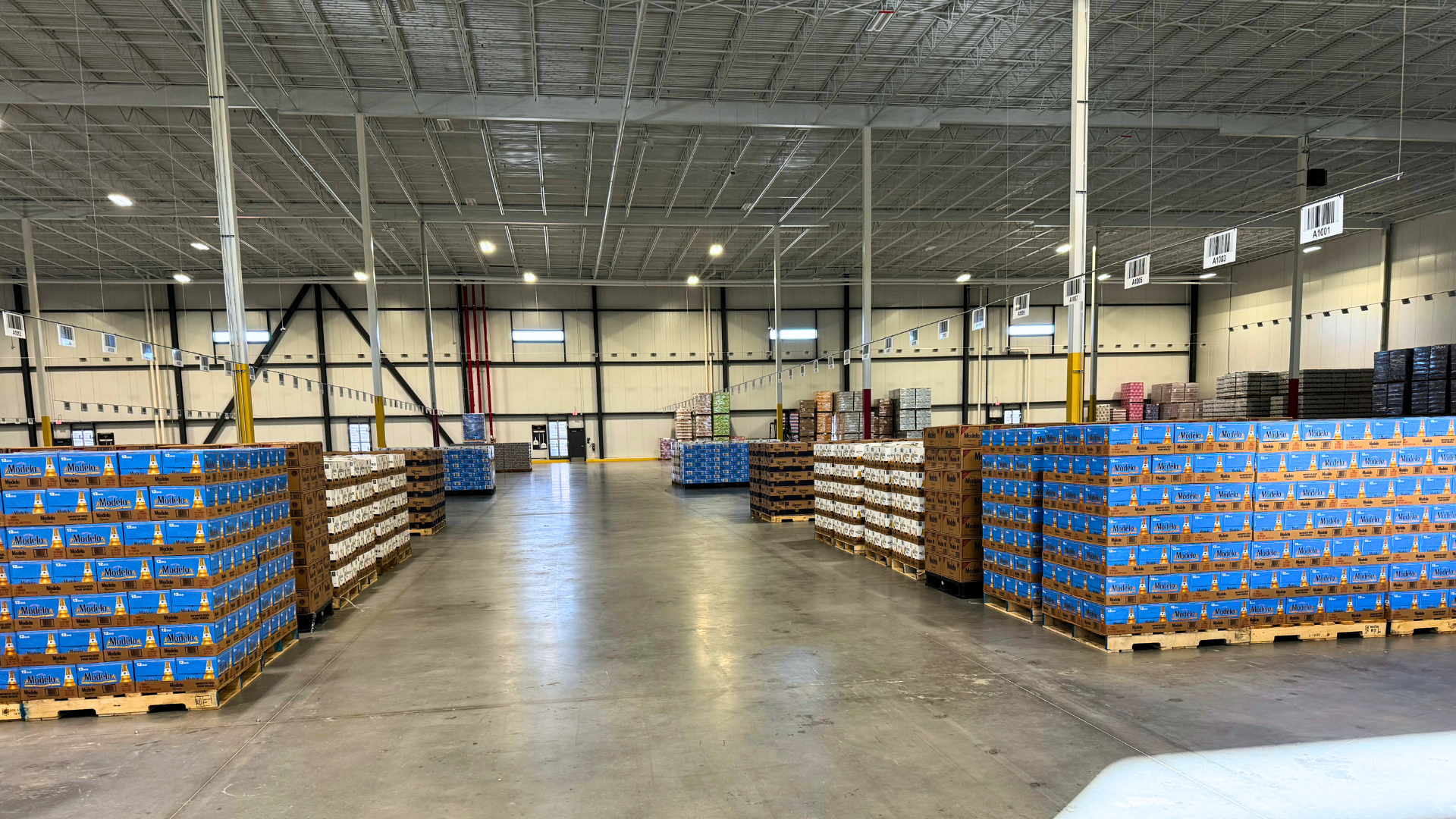 Photo of a warehouse with beer pallets