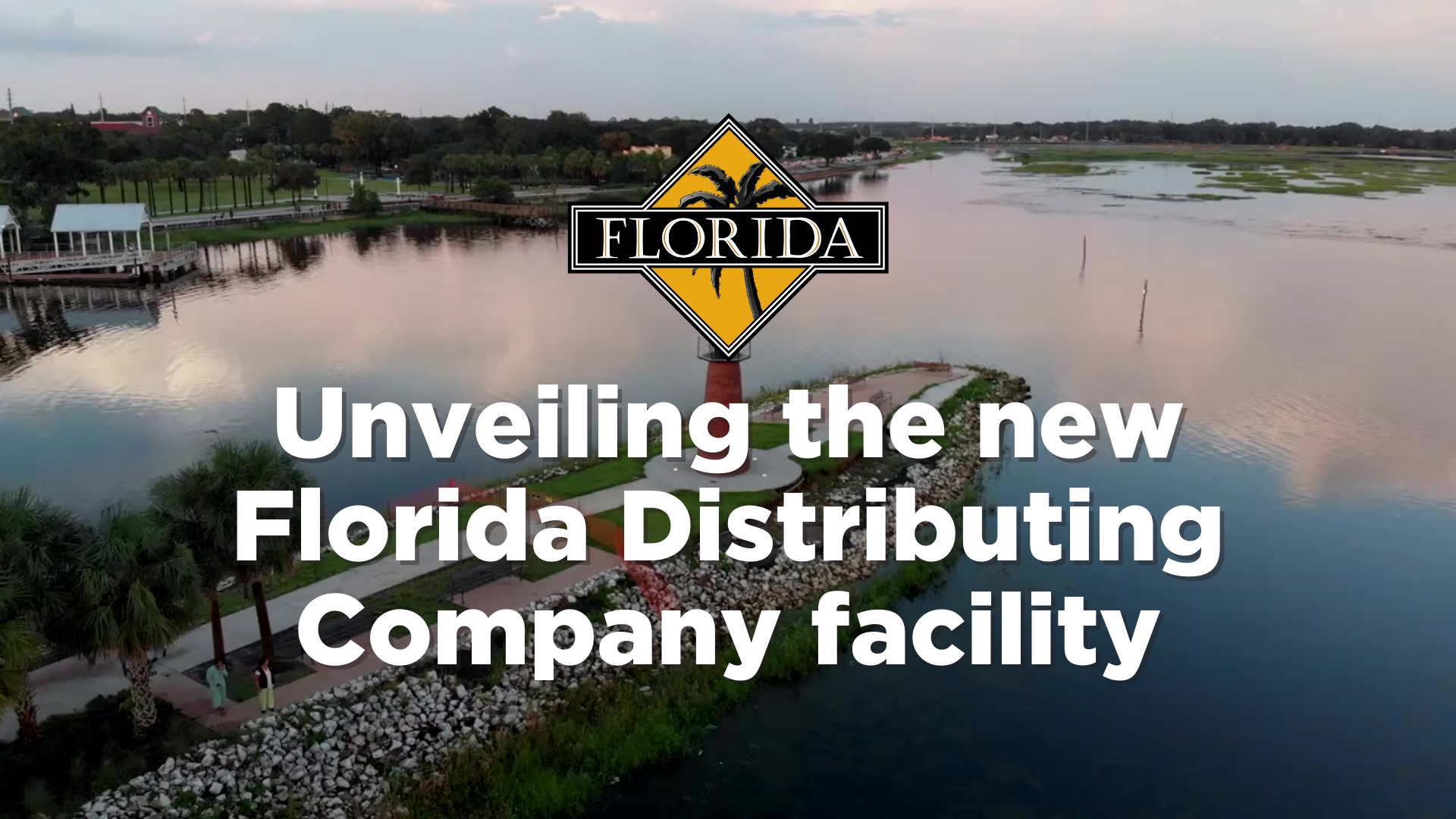 Logo and text unveiling the new Florida Distributing Company facility