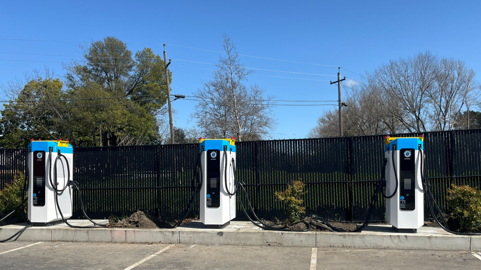 Electric vehicle charging stations in a parking lot