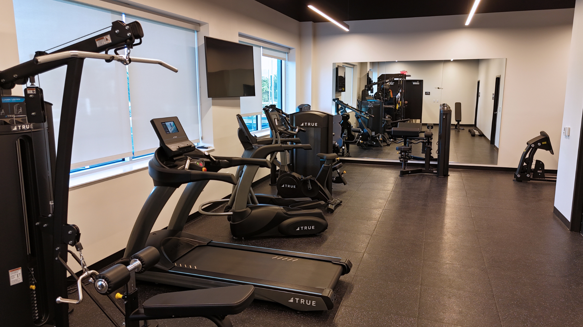 gym area with treadmills and workout machines