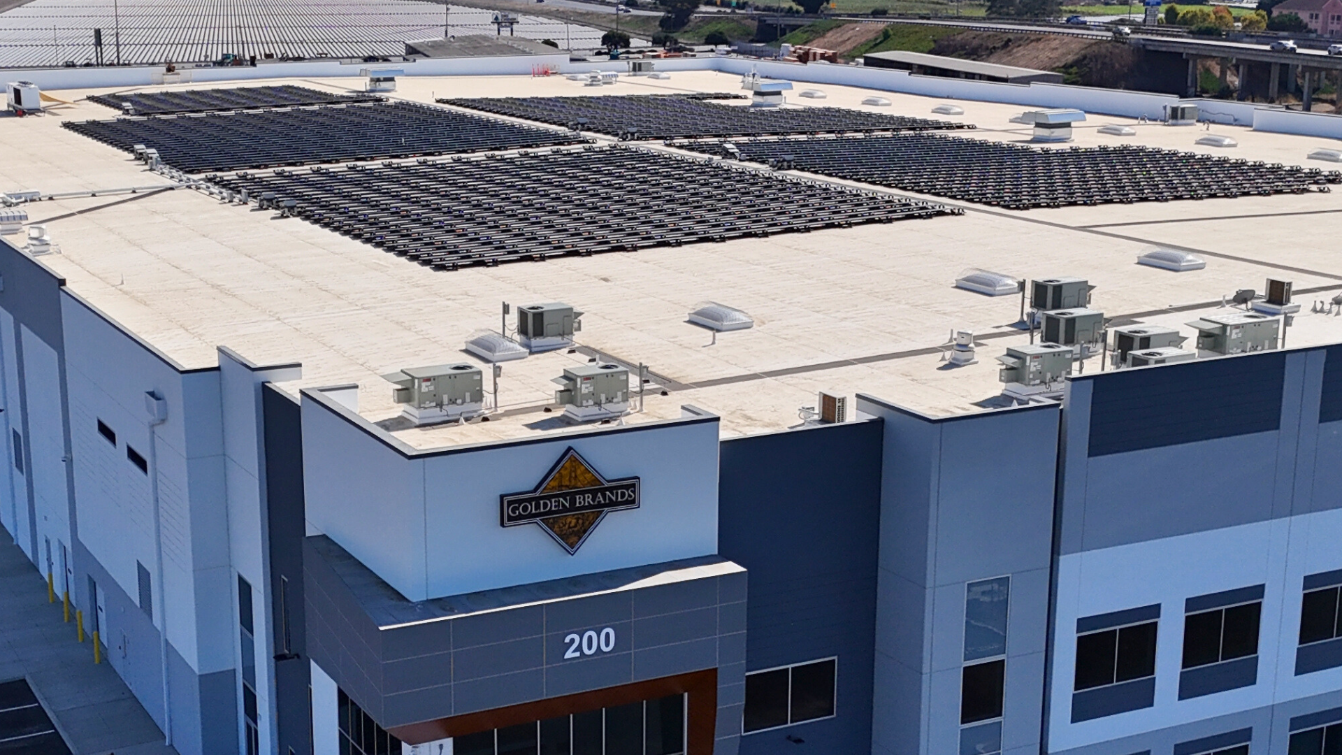 exterior warehouse facility with solar panels on the roof