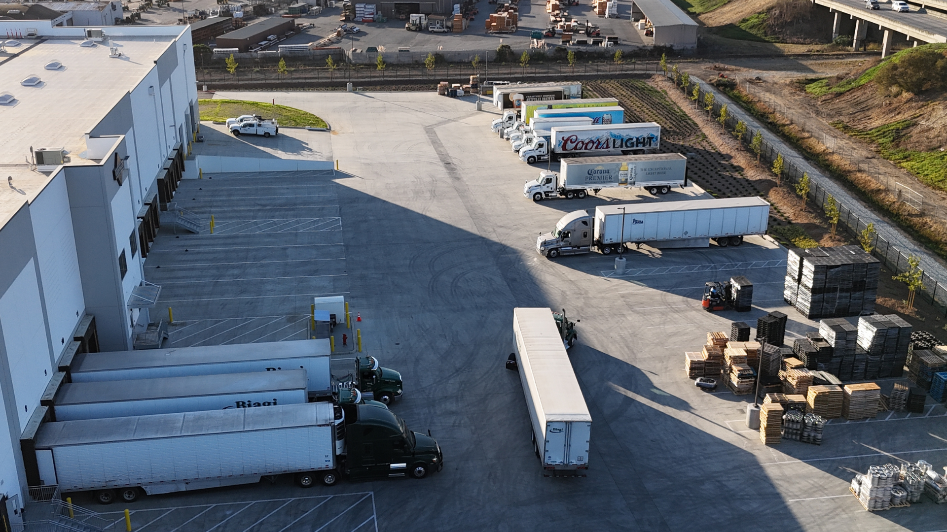 Aerial view of delivery trucks in a parking lot