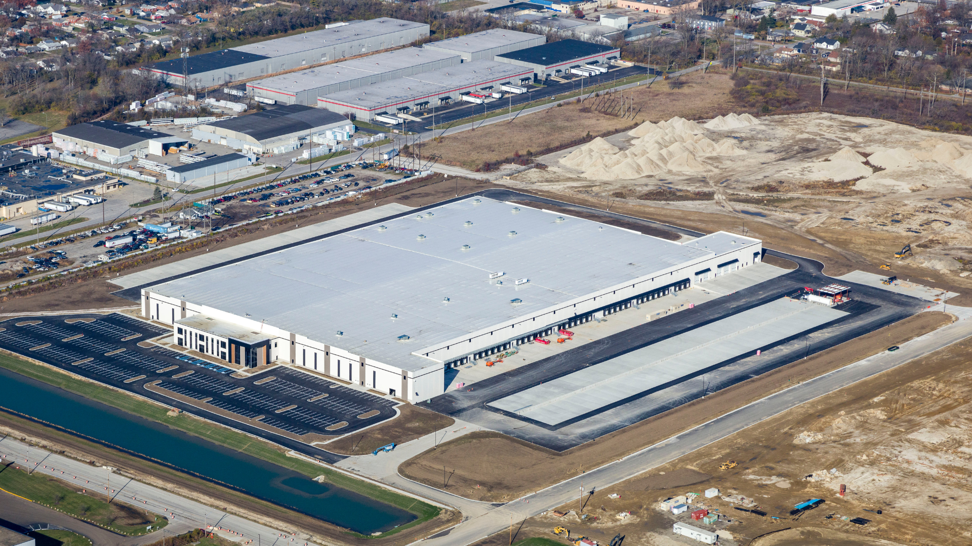 Aerial image of a warehouse and parking lot