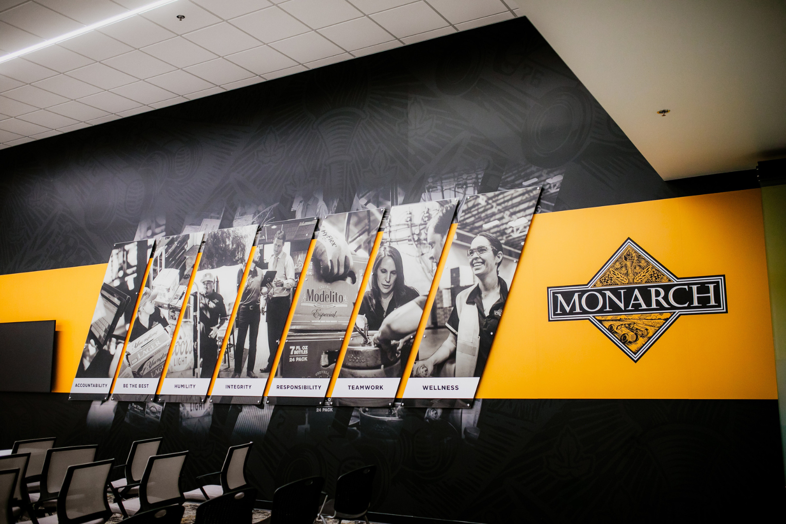 wall mural with employee photos and logo
